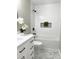 Clean bathroom showcasing a tub with tile surround and updated vanity at 1350 Pinyon Pine Dr, Ladson, SC 29456