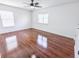 Spacious bedroom featuring hardwood floors, natural light, and a modern ceiling fan at 1350 Pinyon Pine Dr, Ladson, SC 29456
