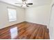 Bright bedroom with wood floors, large window, and ample space at 1350 Pinyon Pine Dr, Ladson, SC 29456