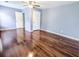 Spacious bedroom with gleaming hardwood floors and a ceiling fan at 1350 Pinyon Pine Dr, Ladson, SC 29456