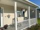 Inviting front porch with rocking chairs and hanging flower baskets at 1350 Pinyon Pine Dr, Ladson, SC 29456