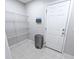Practical laundry area equipped with shelving, tile flooring and storage at 1350 Pinyon Pine Dr, Ladson, SC 29456