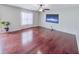 Bright living room with hardwood floors, a ceiling fan, and a large window at 1350 Pinyon Pine Dr, Ladson, SC 29456