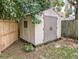 Storage shed in backyard with adjacent wood fence at 1350 Pinyon Pine Dr, Ladson, SC 29456