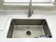 Close-up of a modern sink with a stainless steel faucet and white quartz countertop at 1350 Pinyon Pine Dr, Ladson, SC 29456