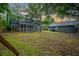 Large backyard featuring a screened in porch and a detached garage at 138 Shadowmoss Pkwy, Charleston, SC 29414