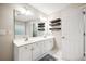 Bathroom featuring a dual sink vanity with white cabinets and a large mirror at 138 Shadowmoss Pkwy, Charleston, SC 29414