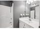 Bathroom with a shower/tub, white vanity, and dark gray walls at 138 Shadowmoss Pkwy, Charleston, SC 29414