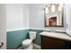 Powder room with blue walls, white fixtures and vanity with granite countertop at 138 Shadowmoss Pkwy, Charleston, SC 29414