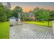 Traditional-style two story home features brick accents, complemented by a spacious driveway at 138 Shadowmoss Pkwy, Charleston, SC 29414