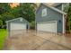 Detached two-car garage plus attached garage provides ample parking and storage space on a concrete driveway at 138 Shadowmoss Pkwy, Charleston, SC 29414