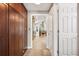 A view of the kitchen from the hallway showing the tile floor and large arched window at 138 Shadowmoss Pkwy, Charleston, SC 29414