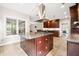 Spacious kitchen featuring granite countertops, tile flooring, large island and stainless steel appliances at 138 Shadowmoss Pkwy, Charleston, SC 29414