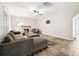 Spacious living room with fireplace, tile floors, ceiling fan and neutral walls at 138 Shadowmoss Pkwy, Charleston, SC 29414