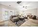 Spacious living room with fireplace, tile floors, ceiling fan, and access to the outdoors at 138 Shadowmoss Pkwy, Charleston, SC 29414