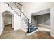 Elegant staircase with tile flooring, white railings, and neutral-toned walls leading to the second floor at 138 Shadowmoss Pkwy, Charleston, SC 29414
