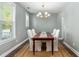 Elegant dining room featuring a classic chandelier and seating for six guests at 1417 Roustabout Way, Charleston, SC 29414