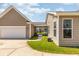 Home exterior featuring a screened porch, manicured lawn and attached garage at 1417 Roustabout Way, Charleston, SC 29414