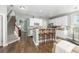 Kitchen featuring white cabinets, counter seating, and hardwood floors at 1417 Roustabout Way, Charleston, SC 29414