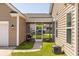 Charming screened porch area adjacent to the home with a manicured lawn at 1417 Roustabout Way, Charleston, SC 29414