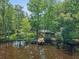 Aerial view showcases the charming pavilion and beautiful waterfront setting at 150 Riverbend Ln, Ridgeville, SC 29472