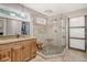 Bathroom featuring an elegant glass enclosed stone shower and wood vanity at 150 Riverbend Ln, Ridgeville, SC 29472