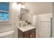 Bright bathroom features a modern vanity, sleek fixtures, and ample lighting at 150 Riverbend Ln, Ridgeville, SC 29472