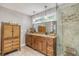 Bathroom featuring stone countertops, wood cabinets, and stylish fixtures at 150 Riverbend Ln, Ridgeville, SC 29472