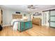 Spacious primary bedroom features natural wood floors, ceiling fan and custom storage options at 150 Riverbend Ln, Ridgeville, SC 29472