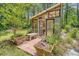 Charming greenhouse with a wooden deck and translucent roof at 150 Riverbend Ln, Ridgeville, SC 29472