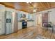 Kitchen with stainless steel appliances, white cabinets, and view of adjacent bathroom at 150 Riverbend Ln, Ridgeville, SC 29472