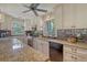 Open concept kitchen with stainless appliances, granite countertops, ample counter space, and window views at 150 Riverbend Ln, Ridgeville, SC 29472
