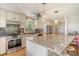 Beautiful kitchen with stainless steel appliances, granite countertop, and large island with seating at 150 Riverbend Ln, Ridgeville, SC 29472