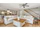 Cozy living room features a ceiling fan, hardwood floors, and comfortable seating at 150 Riverbend Ln, Ridgeville, SC 29472