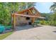 Outdoor kitchen with chairs and table for entertaining at 150 Riverbend Ln, Ridgeville, SC 29472