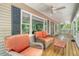 Relaxing porch with comfortable wicker furniture, ceiling fans, and a view of the outdoors at 150 Riverbend Ln, Ridgeville, SC 29472