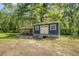 Charming outdoor shed featuring lattice work and an adjacent chicken coop at 150 Riverbend Ln, Ridgeville, SC 29472