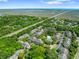 Aerial view of the apartment complex surrounded by lush greenery, with a pool and distant ocean views at 1600 Long Grove Dr # 1115, Mount Pleasant, SC 29464
