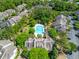 Aerial view of community featuring a swimming pool, surrounding trees, and multi-Gathering residential buildings at 1600 Long Grove Dr # 1115, Mount Pleasant, SC 29464