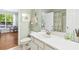 Well-lit bathroom features a white vanity, modern fixtures, and serene decor at 1600 Long Grove Dr # 1115, Mount Pleasant, SC 29464