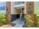 Apartment building entrance with brick accents, unit numbers and exterior lighting at 1600 Long Grove Dr # 1115, Mount Pleasant, SC 29464