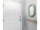 Entryway featuring a white door, neutral wall paint, a decorative mirror, and a small decorative shelf at 1600 Long Grove Dr # 1115, Mount Pleasant, SC 29464