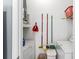 Functional laundry room with a washer, dryer, shelving, and cleaning supplies at 1600 Long Grove Dr # 1115, Mount Pleasant, SC 29464