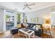 Comfortable living room with a sectional sofa, large windows, and a ceiling fan at 1600 Long Grove Dr # 1115, Mount Pleasant, SC 29464