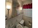 Bathroom with a toilet, sink, and mirror at 1674 Garden St, Charleston, SC 29407