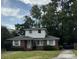 Charming two-story brick home with a well-maintained lawn and driveway leading to the street at 1674 Garden St, Charleston, SC 29407