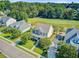 Desirable home with a manicured lawn, mature trees, and scenic views of a golf course and pond at 173 Silver Cypress Cir, Summerville, SC 29485