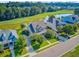 Residential property with a well-kept lawn, pond views, and access to a nearby golf course at 173 Silver Cypress Cir, Summerville, SC 29485