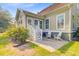 Charming backyard patio with white chairs and stairs, perfect for outdoor relaxation and entertaining at 173 Silver Cypress Cir, Summerville, SC 29485