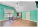 An empty bedroom with bright teal walls, a ceiling fan, and a window at 173 Silver Cypress Cir, Summerville, SC 29485